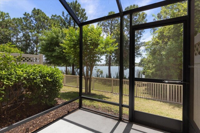 11442 Crowned Sparrow Ln, Tampa, FL 33626 - unfurnished sunroom featuring a water view