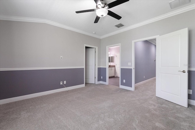 11442 Crowned Sparrow Ln, Tampa, FL 33626 - unfurnished bedroom featuring ornamental molding, visible vents, light colored carpet, and baseboards