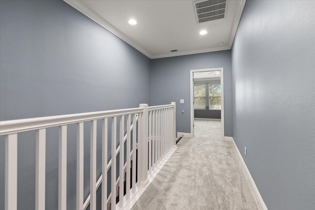 11442 Crowned Sparrow Ln, Tampa, FL 33626 - hall with an upstairs landing, crown molding, visible vents, baseboards, and carpet floors