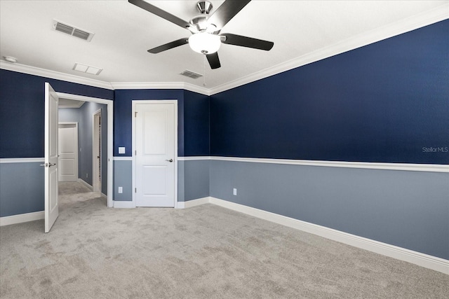 11442 Crowned Sparrow Ln, Tampa, FL 33626 - unfurnished bedroom featuring ornamental molding, a ceiling fan, visible vents, and carpet