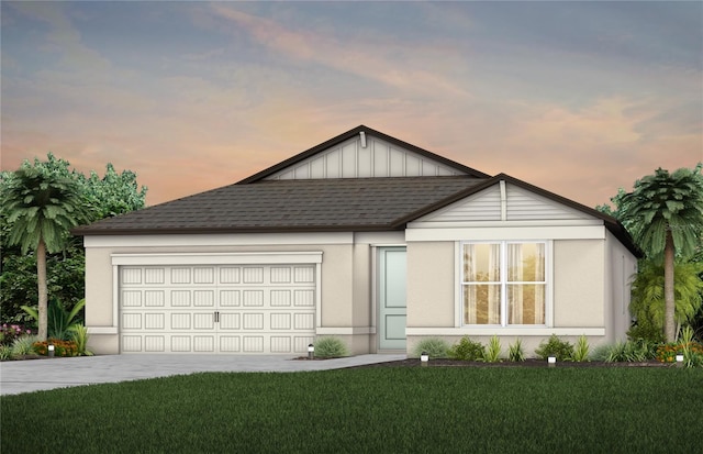 ranch-style house featuring driveway, a garage, a lawn, a shingled roof, and stucco siding