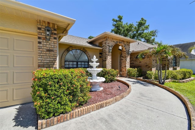 2914 Timber Knoll Dr, Valrico, FL 33596 - view of front of property with brick siding, an attached garage, and a shingled roof