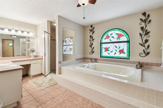 2914 Timber Knoll Dr, Valrico, FL 33596 - full bath with vanity, a garden tub, tile patterned floors, a ceiling fan, and a shower stall