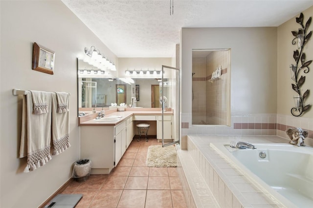 2914 Timber Knoll Dr, Valrico, FL 33596 - bathroom with a garden tub, vanity, tile patterned floors, a tile shower, and a textured ceiling
