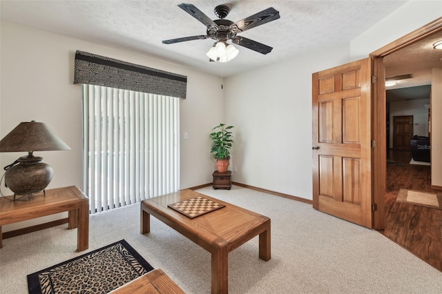 2914 Timber Knoll Dr, Valrico, FL 33596 - living room with light carpet, a textured ceiling, a ceiling fan, and plenty of natural light