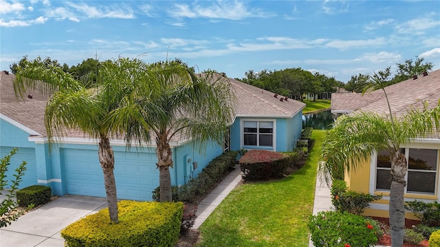 11457 Captiva Kay Dr, Riverview, FL 33569 - view of front facade featuring stucco siding, driveway, and an attached garage