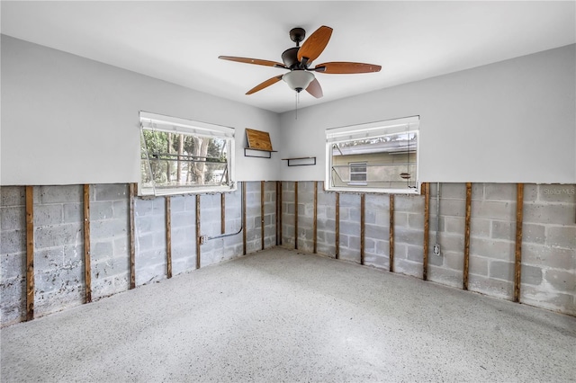 basement featuring ceiling fan