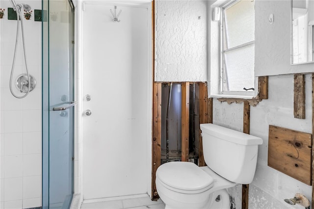 bathroom with toilet and a stall shower