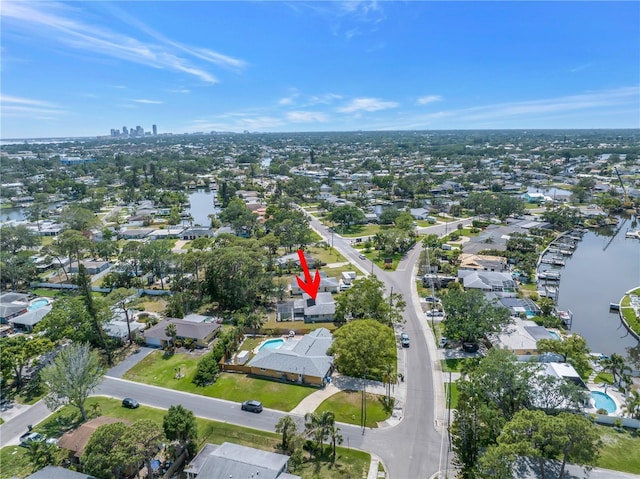 bird's eye view with a residential view and a water view
