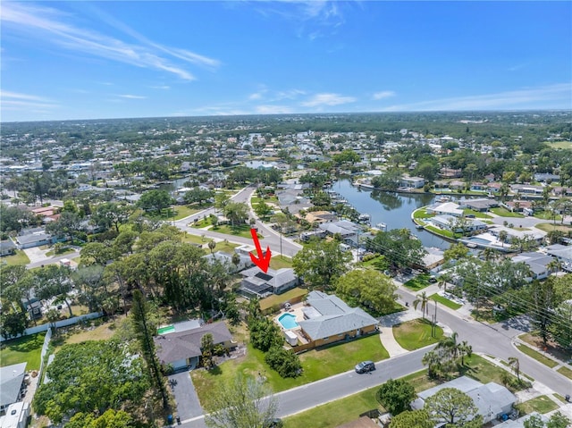aerial view with a residential view and a water view