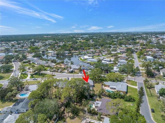 bird's eye view with a residential view and a water view