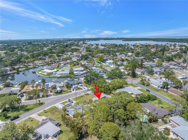 aerial view featuring a residential view and a water view
