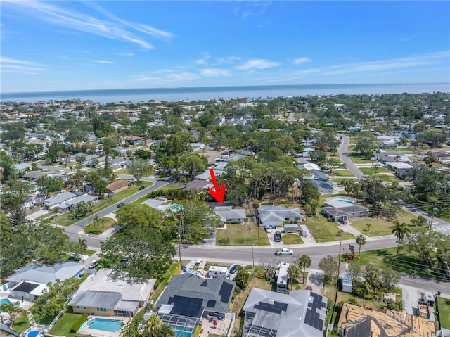 birds eye view of property with a residential view and a water view