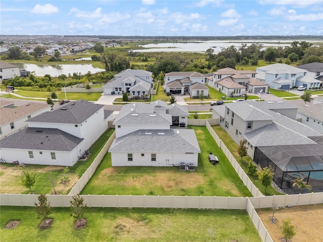 aerial view featuring a water view and a residential view