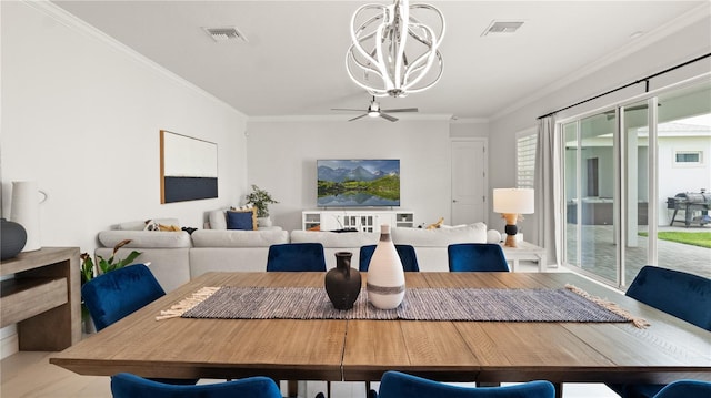 dining space featuring visible vents, an inviting chandelier, and crown molding