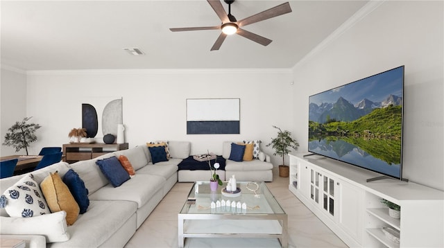 living room with ornamental molding, a ceiling fan, marble finish floor, and visible vents