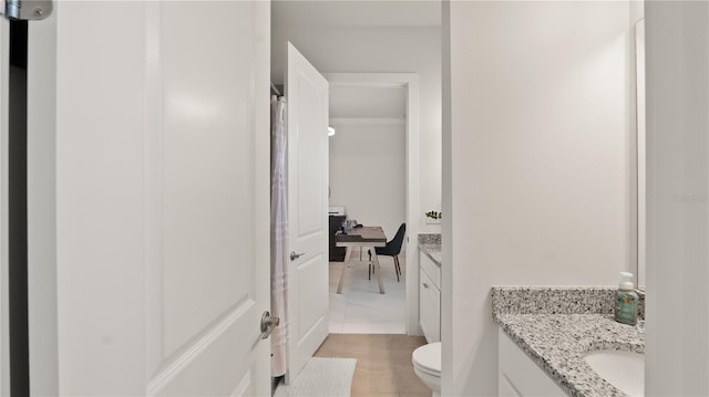 full bathroom featuring vanity and toilet
