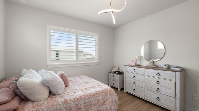 bedroom featuring light wood-style flooring