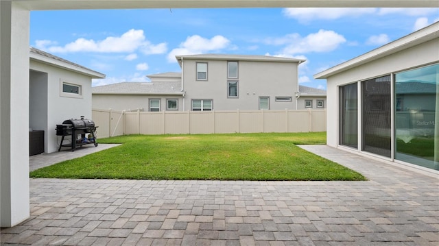 view of yard with a patio and a fenced backyard