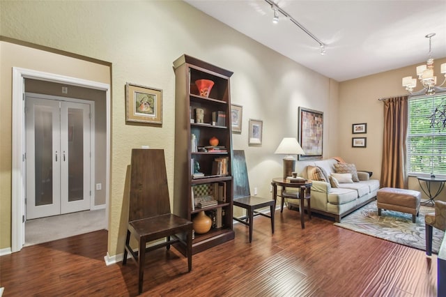 504 S Armenia Ave Unit 1338, Tampa, FL 33609 - sitting room with track lighting, a chandelier, and dark wood-type flooring