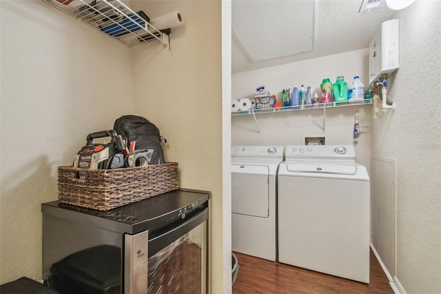 504 S Armenia Ave Unit 1338, Tampa, FL 33609 - laundry area with attic access, laundry area, water heater, washer and dryer, and wood finished floors