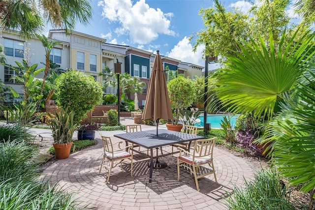 504 S Armenia Ave Unit 1338, Tampa, FL 33609 - view of patio featuring outdoor dining area and an outdoor pool