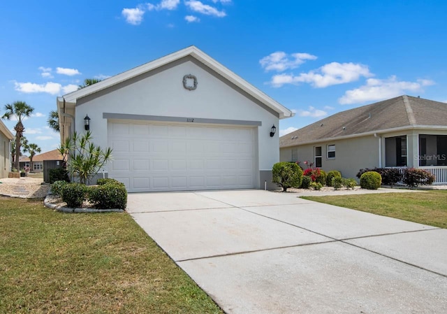 single story home featuring stucco siding, driveway, and a front lawn