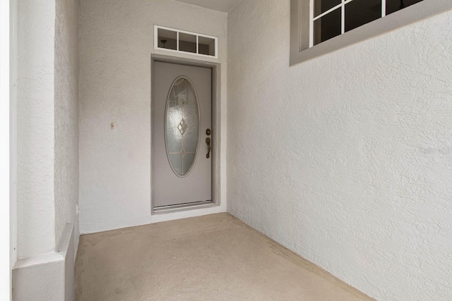 doorway to property with stucco siding