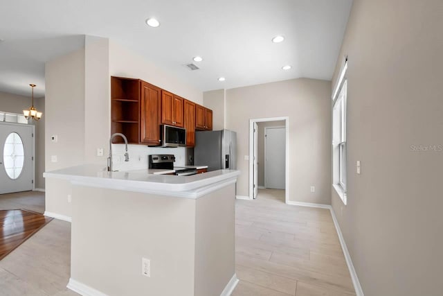 kitchen with a chandelier, stainless steel appliances, open shelves, brown cabinetry, and visible vents