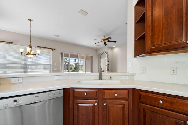 kitchen with light countertops, dishwasher, ceiling fan with notable chandelier, and a sink