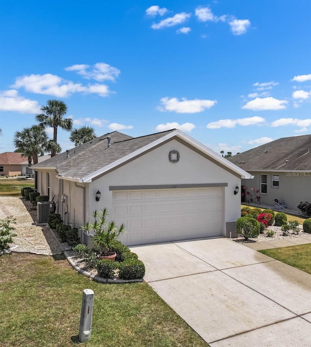view of front of home featuring cooling unit, concrete driveway, a front yard, an attached garage, and stucco siding