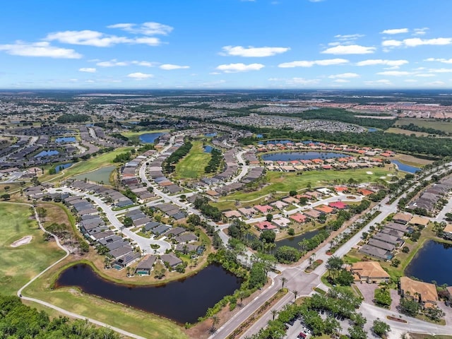 aerial view featuring a residential view, a water view, and golf course view