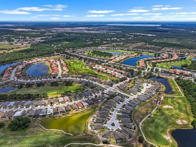 birds eye view of property featuring a water view, a residential view, and view of golf course