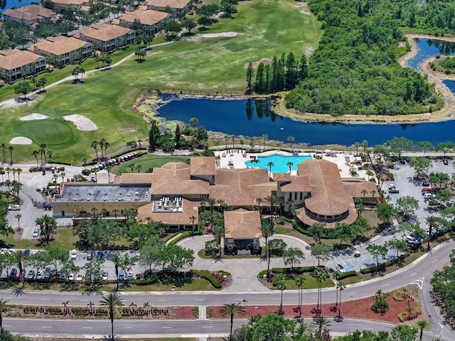 aerial view with a water view and view of golf course