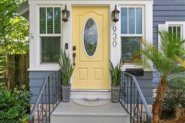 doorway to property with fence