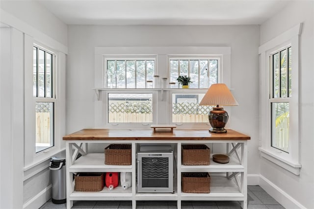 interior space with tile patterned flooring and baseboards