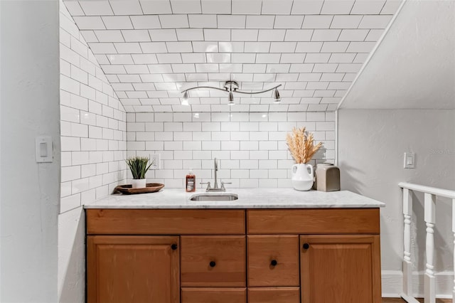 interior space with decorative backsplash and a sink