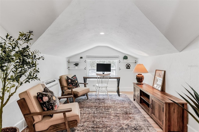 interior space featuring vaulted ceiling and light wood-style flooring