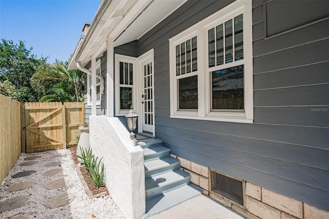 view of side of property with a gate and fence