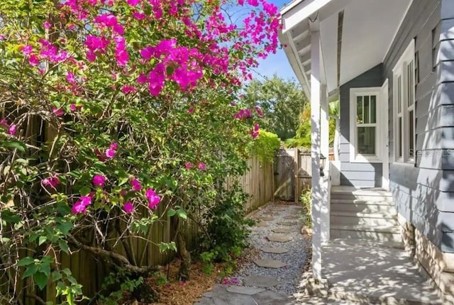 view of home's exterior with fence