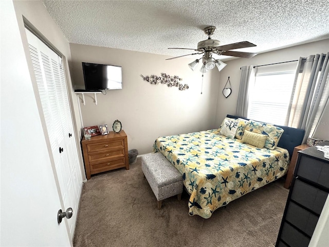 13924 Pathfinder Dr, Tampa, FL 33625 - bedroom with carpet, a closet, a textured ceiling, and a ceiling fan