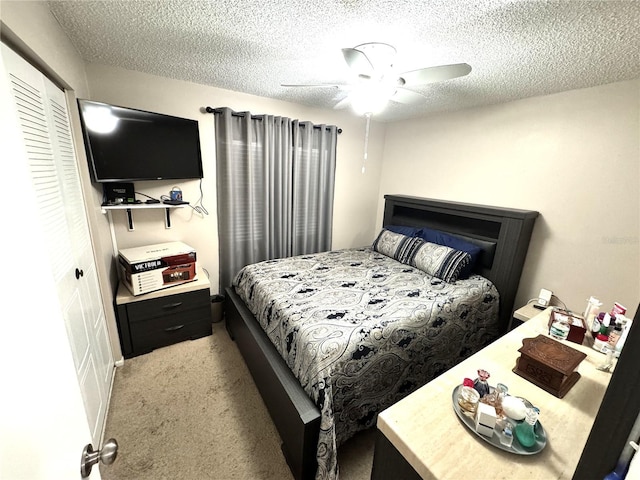 13924 Pathfinder Dr, Tampa, FL 33625 - carpeted bedroom with a textured ceiling, a closet, and a ceiling fan