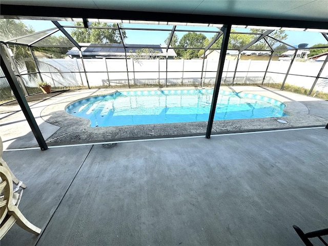 13924 Pathfinder Dr, Tampa, FL 33625 - view of swimming pool with a fenced backyard, glass enclosure, and a patio area