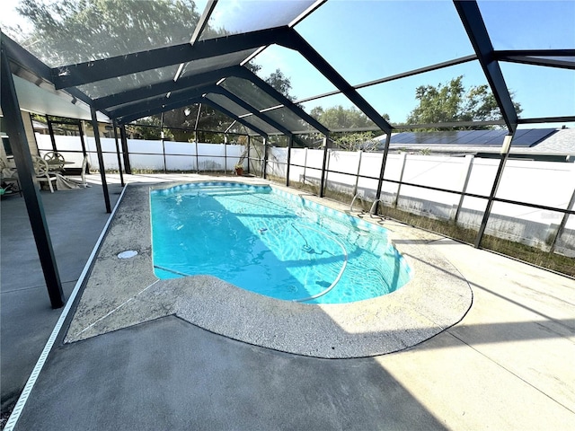 13924 Pathfinder Dr, Tampa, FL 33625 - view of swimming pool featuring a patio area, a fenced backyard, and a lanai