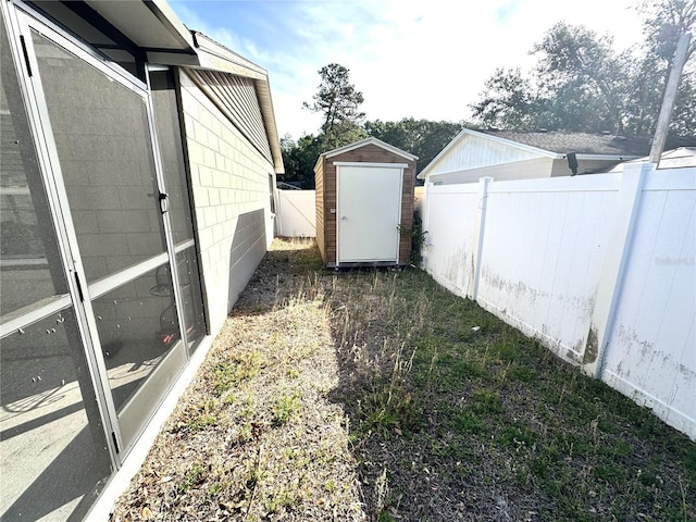 13924 Pathfinder Dr, Tampa, FL 33625 - fenced backyard with a storage unit and an outbuilding