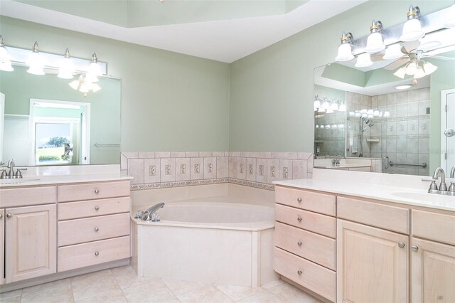bathroom with a sink, ceiling fan, a stall shower, and two vanities