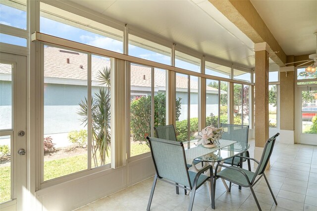 sunroom / solarium with tile patterned floors and a wealth of natural light