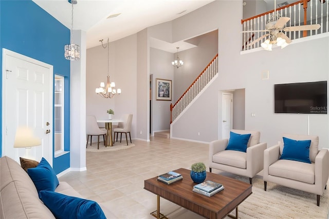 tiled living room with high vaulted ceiling, baseboards, stairs, and a notable chandelier
