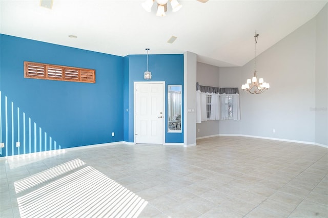 spare room with baseboards, ceiling fan with notable chandelier, light tile patterned floors, and high vaulted ceiling