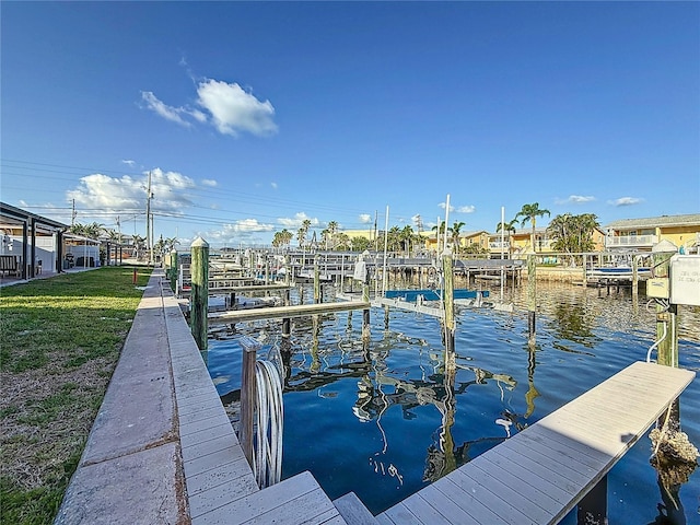 2600 N Paula Dr Unit 2B, Dunedin, FL 34698 - dock with a water view, boat lift, and a lawn